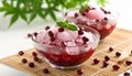 generated using AI.Two glass bowls filled with a pink shaved ice dessert topped with small red kidney beans Royalty Free Stock Photo