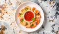 generated using AI.Plate of cooked shrimp arranged in a circle around a small bowl of red chili sauce. Royalty Free Stock Photo