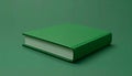 Miniature book on matte moss green background symbolizing knowledge Royalty Free Stock Photo
