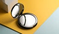 generated using AI.Open compact mirror with a sleek black plastic casing on a two-tone surface of yellow and light blue. Royalty Free Stock Photo