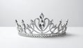 generated using AI.Silver tiara adorned with intricate patterns of clear gemstones, creating loops and pointed elements. Royalty Free Stock Photo