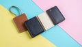 generated using AI.Leather wallets arranged on a pastel colored geometric background. Royalty Free Stock Photo