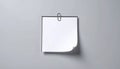 generated using AI.A plain white piece of paper is clipped to a wall using a metallic paperclip. Royalty Free Stock Photo