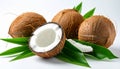 Fresh ripe coconuts with green leaves on white background Royalty Free Stock Photo