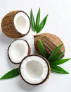 Fresh ripe coconuts with green leaves on white background Royalty Free Stock Photo