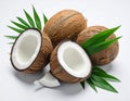Fresh ripe coconuts with green leaves on white background Royalty Free Stock Photo