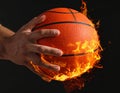 Basketball player with hot ball on black background, closeup. Space for text. Royalty Free Stock Photo