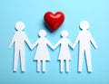 Paper family figures and red heart on light blue background, flat lay. Insurance Royalty Free Stock Photo