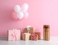 Many gift boxes and balloons near bright pink background Royalty Free Stock Photo