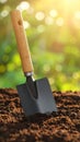 Shovel in soil outdoors, space for text. Gardening tool Royalty Free Stock Photo