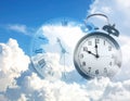 Time concept. Double exposure of blue sky with fluffy clouds and clock Royalty Free Stock Photo