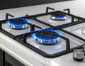Gas burners with blue flame on modern stove Royalty Free Stock Photo