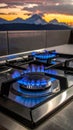 Gas burners with blue flame on modern stove Royalty Free Stock Photo
