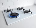 Gas burners with blue flame on modern stove Royalty Free Stock Photo