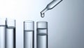 Dripping liquid from pipette into test tube on grey background, closeup Royalty Free Stock Photo