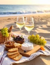 Glasses with white wine and snacks for beach picnic on sandy seashore Royalty Free Stock Photo