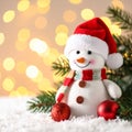 Cute snowman, fire tree branches and balls against fuzzy Christmas lights, bokeh effect Royalty Free Stock Photo