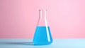 A clear glass Erlenmeyer flask partially filled with a transparent liquid is positioned against a light color background. Royalty Free Stock Photo
