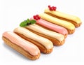 Eclairs with colorful glaze and pistachio toppings. Royalty Free Stock Photo