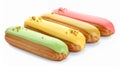 Eclairs with colorful glaze and pistachio toppings. Royalty Free Stock Photo