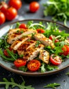 Fresh salad features arugula (Eruca vesicaria) as the base, topped with grilled chicken slices Royalty Free Stock Photo