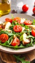 Fresh salad features arugula (Eruca vesicaria) as the base, topped with grilled chicken slices Royalty Free Stock Photo