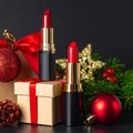 Red lipstick stands upright against a backdrop of wrapped gifts adorned with red ribbons. Royalty Free Stock Photo