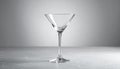 Elegant empty martini glass on grey background. Space for text Royalty Free Stock Photo
