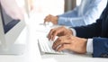 Close-up of business person typing on computer keyboard in modern office, symbolizing technology Royalty Free Stock Photo