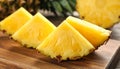 Pieces of tasty ripe pineapple on wooden board, closeup Royalty Free Stock Photo