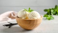 Bowl and spoon with tasty vanilla ice cream on table Royalty Free Stock Photo