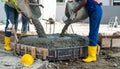 Construction Workers Pouring Concrete into Formwork Royalty Free Stock Photo