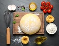 Board with homemade pasta, flour and ingredients on dark table, flat lay Royalty Free Stock Photo