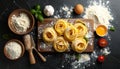 Board with homemade pasta, flour and ingredients on dark table, flat lay Royalty Free Stock Photo