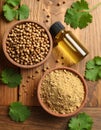 Coriander essential oil, powder, seeds and green leaves on wooden table, top view Royalty Free Stock Photo