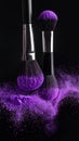 Makeup brushes with purple eye shadow on black background, closeup. Royalty Free Stock Photo