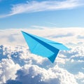 Light blue paper plane flying in sky with clouds with clouds Royalty Free Stock Photo
