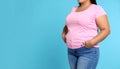 Overweight woman on color background, closeup. Space for text Royalty Free Stock Photo