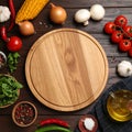 Cooking concept. Cutting board and different products on wooden table, flat lay Royalty Free Stock Photo