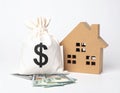 Home Finance Concept with Money Bag and House Royalty Free Stock Photo