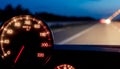 Night Driving Speedometer and Blurred Road Lights Royalty Free Stock Photo