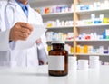 Pharmacist holding prescription paper in pharmacy with medicine bottles Royalty Free Stock Photo
