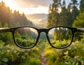 Glasses against the beautiful forest. View more clearly through the lenses. Royalty Free Stock Photo