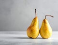 Two ripe pears on the gray table, shut up. Text area Royalty Free Stock Photo