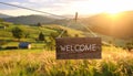 Welcome card. Wooden board with word hanging on rope in countryside Royalty Free Stock Photo