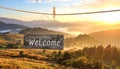 Welcome card. Wooden board with word hanging on rope in countryside Royalty Free Stock Photo