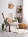 Soft armchair with pillow in light room Royalty Free Stock Photo