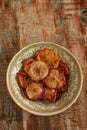 Baked apple chips on a vintage plate Royalty Free Stock Photo
