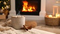Cup of hot drink near fireplace at home. Space for text Royalty Free Stock Photo