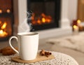 Cup of hot drink near fireplace at home. Space for text Royalty Free Stock Photo